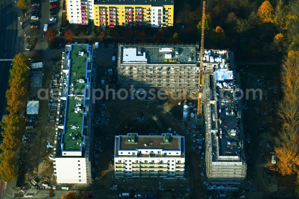 Berlin from the bird's eye view: Construction site for the new residential and commercial building on the Schwarzheider Strasse corner Louis-Lewin-Strasse - Forster Strasse in the district Hellersdorf in Berlin, Germany