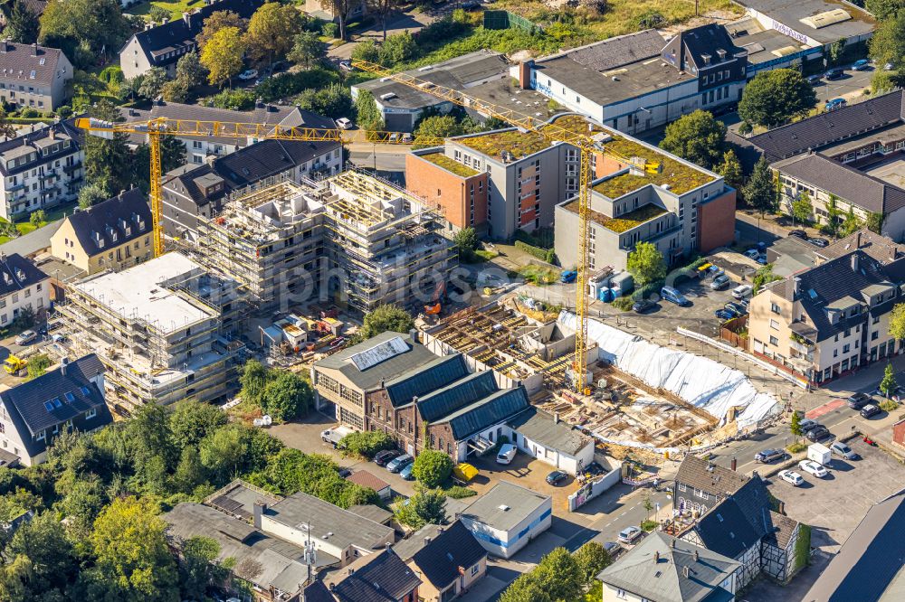 Heiligenhaus from the bird's eye view: Construction site for the new residential and commercial building Suedringterassen on street Frankenstrasse - Hauptstrasse - Suedring in Heiligenhaus at Ruhrgebiet in the state North Rhine-Westphalia, Germany