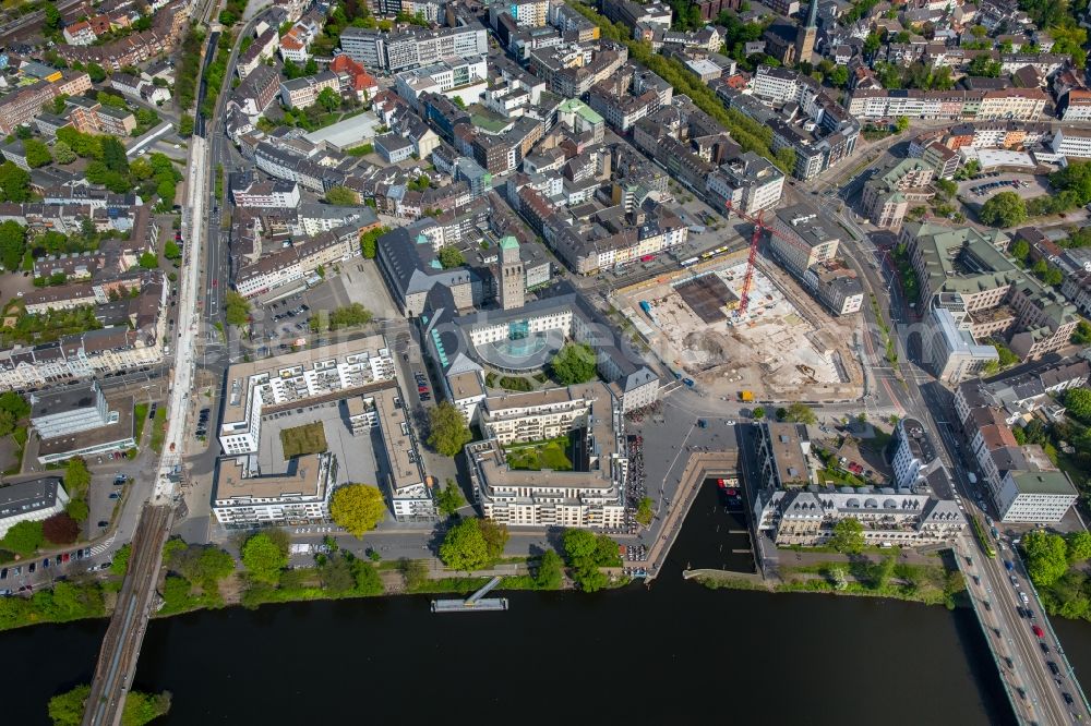 Mülheim an der Ruhr from the bird's eye view: Construction site for the new building eines Wohn- and Geschaeftshausviertels on Schlossstrasse - Schollenstrasse - Friedrich-Ebert-Allee nach Entwuerfen of AIP Architekten & Ingenieure fuer Projektplanung in Muelheim on the Ruhr in the state North Rhine-Westphalia