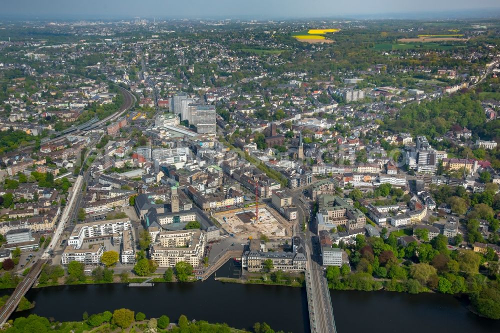 Mülheim an der Ruhr from above - Construction site for the new building eines Wohn- and Geschaeftshausviertels on Schlossstrasse - Schollenstrasse - Friedrich-Ebert-Allee nach Entwuerfen of AIP Architekten & Ingenieure fuer Projektplanung in Muelheim on the Ruhr in the state North Rhine-Westphalia