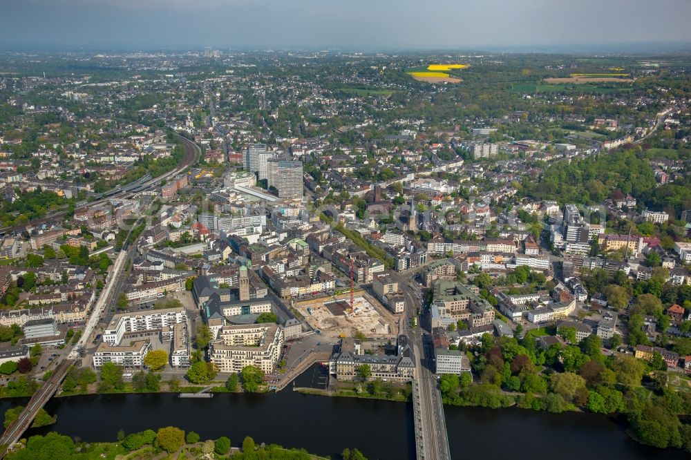 Mülheim an der Ruhr from the bird's eye view: Construction site for the new building eines Wohn- and Geschaeftshausviertels on Schlossstrasse - Schollenstrasse - Friedrich-Ebert-Allee nach Entwuerfen of AIP Architekten & Ingenieure fuer Projektplanung in Muelheim on the Ruhr in the state North Rhine-Westphalia