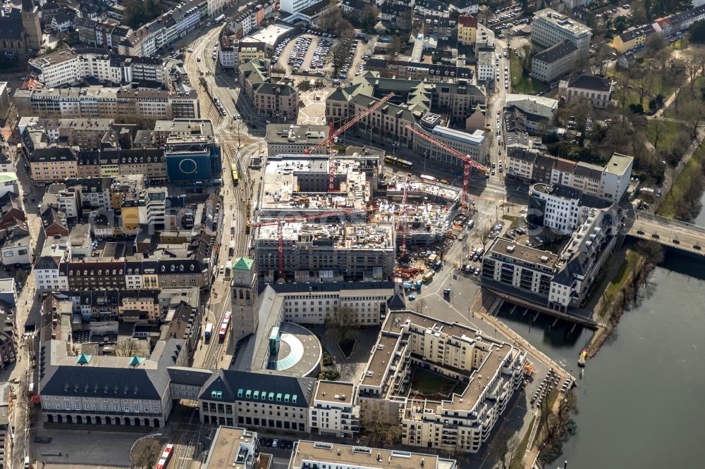 Mülheim an der Ruhr from the bird's eye view: Construction site for the new building eines Wohn- and Geschaeftshausviertels on Schlossstrasse - Schollenstrasse - Friedrich-Ebert-Allee in Muelheim on the Ruhr in the state North Rhine-Westphalia