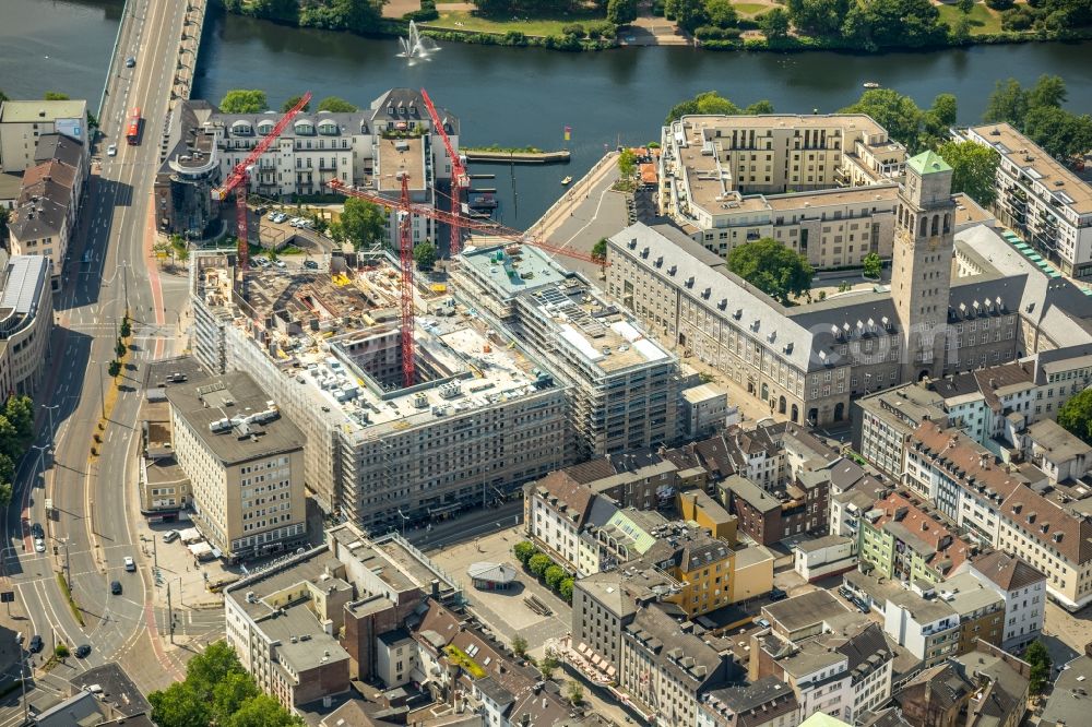 Aerial photograph Mülheim an der Ruhr - Construction site for the new building eines Wohn- and Geschaeftshausviertels on Schlossstrasse - Schollenstrasse - Friedrich-Ebert-Allee in Muelheim on the Ruhr in the state North Rhine-Westphalia