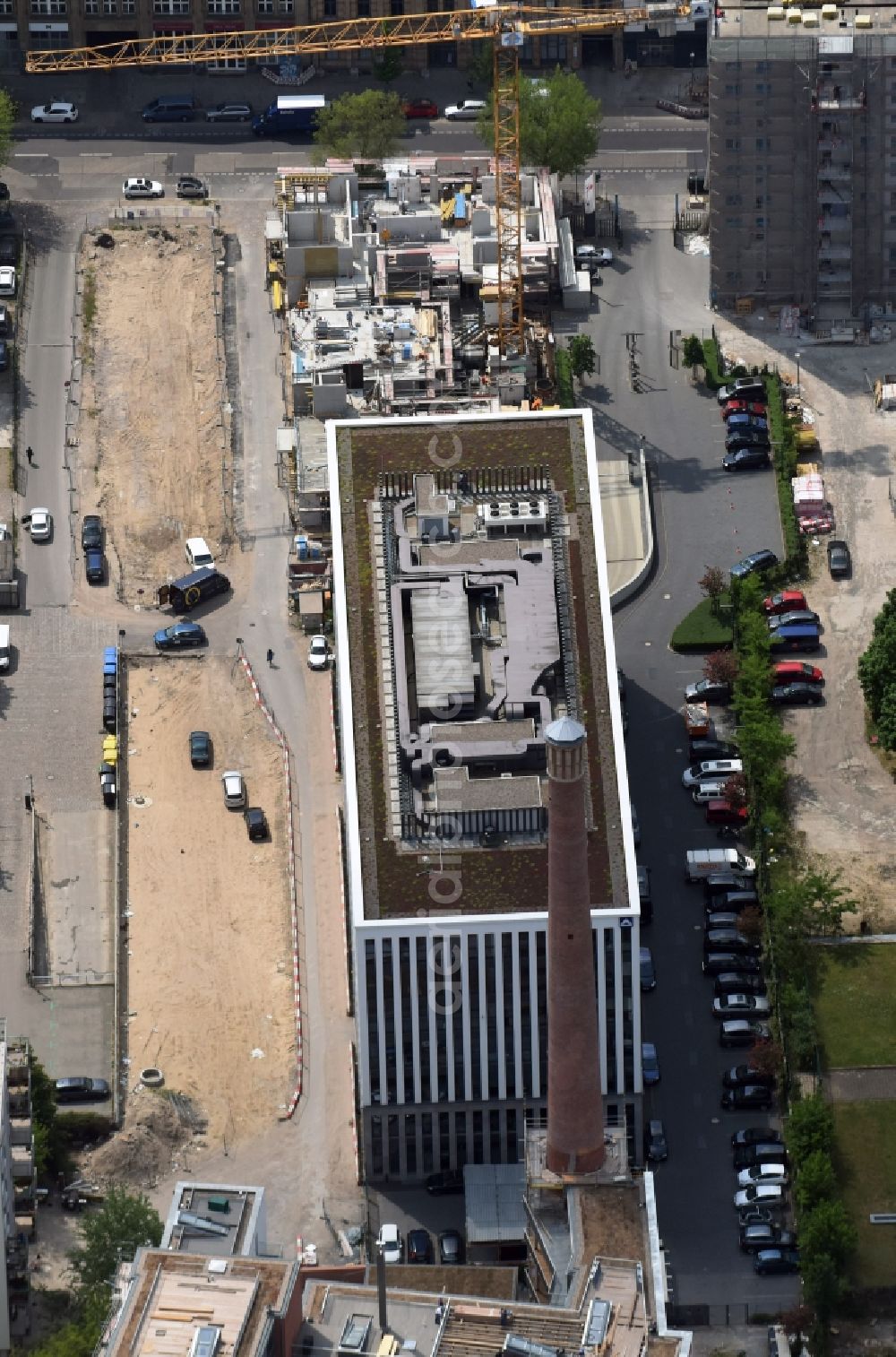 Aerial photograph Berlin - Construction site for the new building with residential and commercial units on a former factory site on Koepenicker Strasse in Kreuzberg district in Berlin, Germany