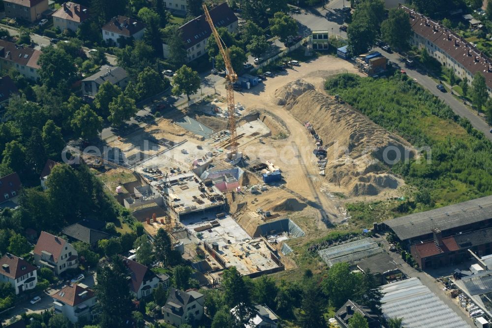 Berlin from the bird's eye view: Construction site for the new residential building Alte Gaertnerei in the Zehlendorf part of Berlin in Germany. The new complex is being built on Sundgauer Strasse and Schlettstadter Strasse. It will include apartments, park and gardens