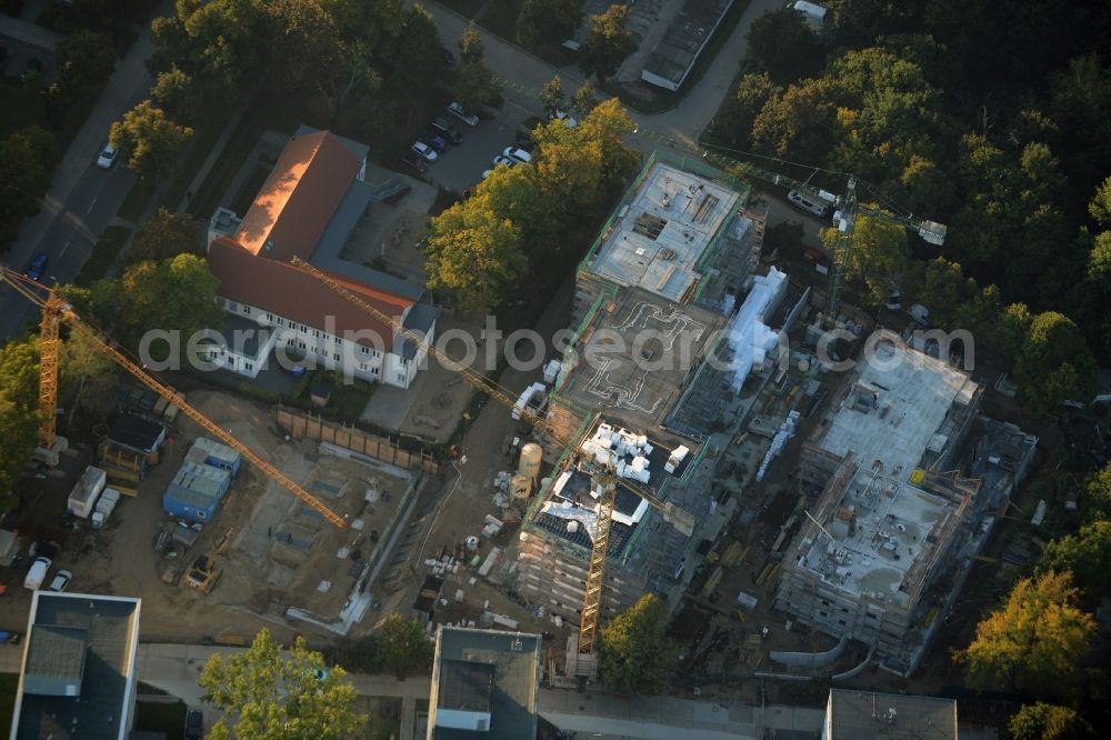 Teltow from the bird's eye view: Construction site for the new building of a residential estate on the corner of Elbestrasse and Iserstrasse in Teltow in the state of Brandenburg. The estate will consist of several buildings