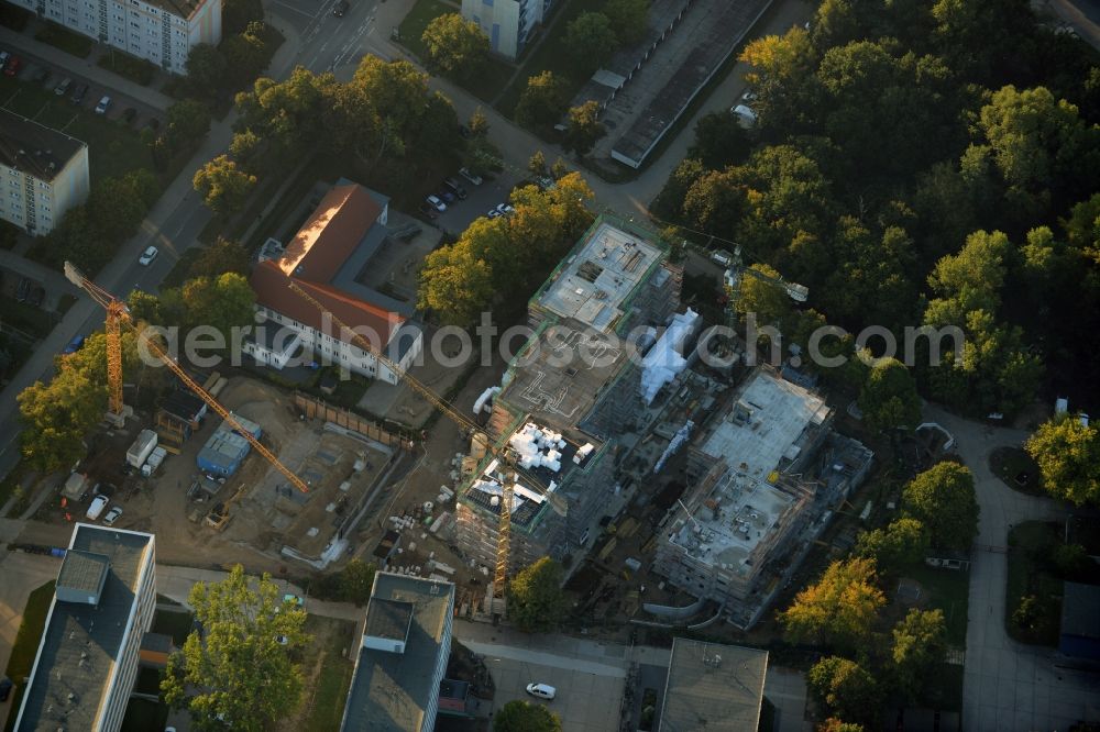 Aerial image Teltow - Construction site for the new building of a residential estate on the corner of Elbestrasse and Iserstrasse in Teltow in the state of Brandenburg. The estate will consist of several buildings