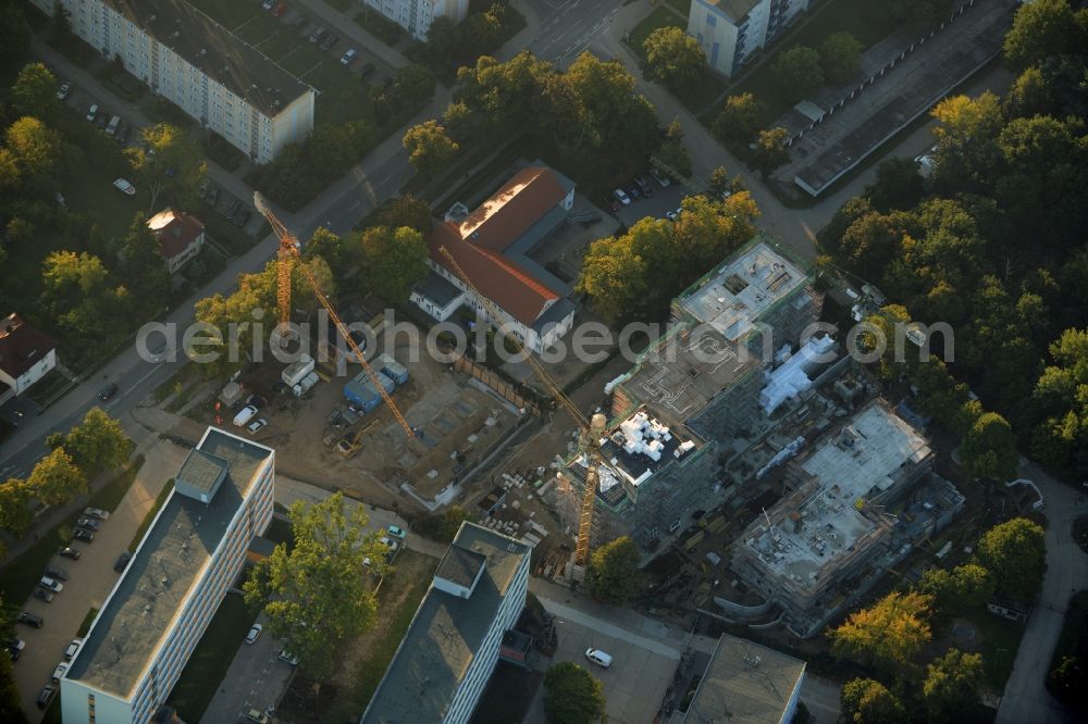 Aerial photograph Teltow - Construction site for the new building of a residential estate on the corner of Elbestrasse and Iserstrasse in Teltow in the state of Brandenburg. The estate will consist of several buildings