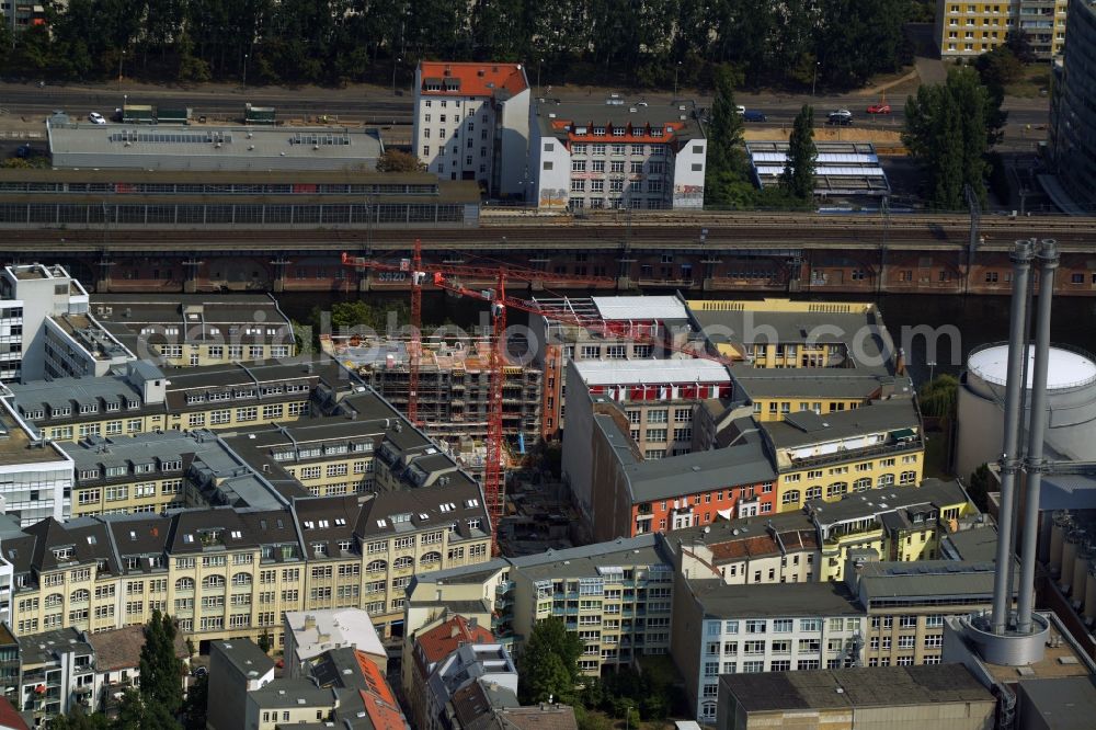 Berlin from above - Construction site for the new residential estate Be Mitte in Rungestrasse in the Mitte part of Berlin in Germany. The construction site is surrounded by residential and office buildings and located on the Spree riverbank