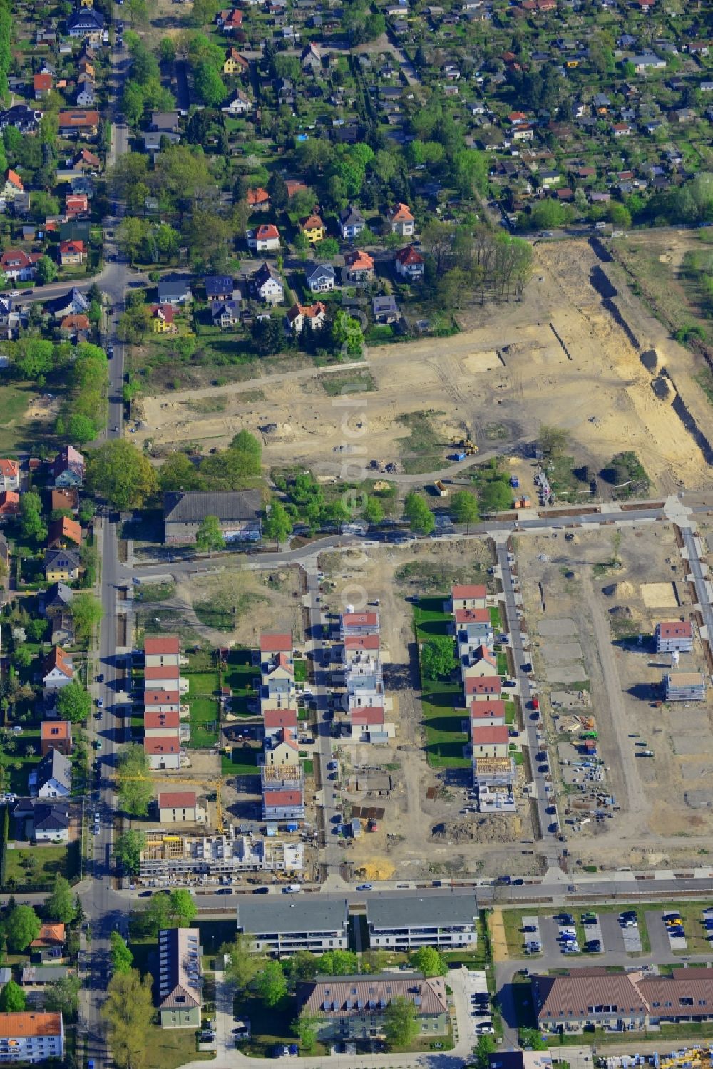 Aerial image Berlin - Construction site to build a new multi-family residential complex on Rinchnancher Weg in the district of Lichtenberg in Berlin in Germany. The new developments of the Gartenstadt Karlshorst include a residential area with single family, semi-detached urban houses