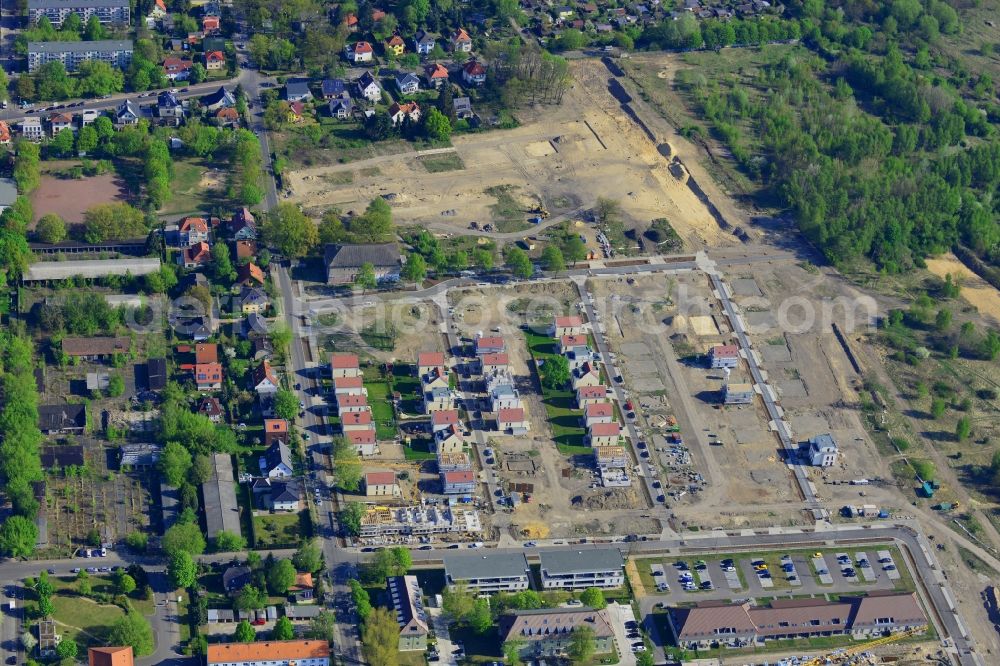 Aerial photograph Berlin - Construction site to build a new multi-family residential complex on Rinchnancher Weg in the district of Lichtenberg in Berlin in Germany. The new developments of the Gartenstadt Karlshorst include a residential area with single family, semi-detached urban houses