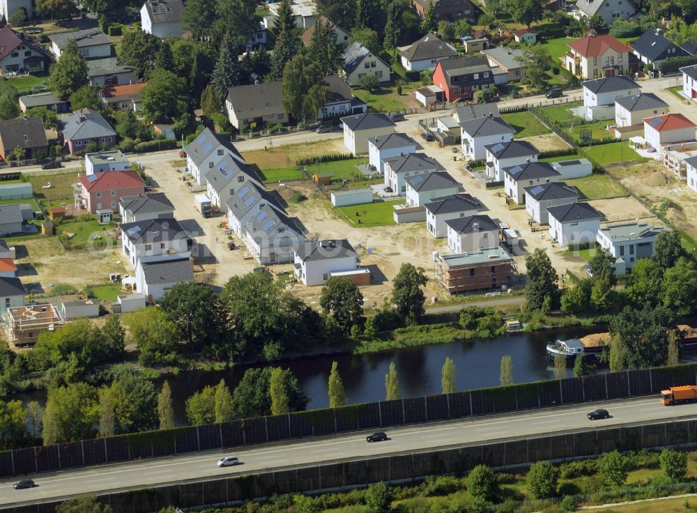 Aerial photograph Berlin - Construction site to build a new residential complex at the Minzeweg in front of the Teltowkanal in Berlin in Germany