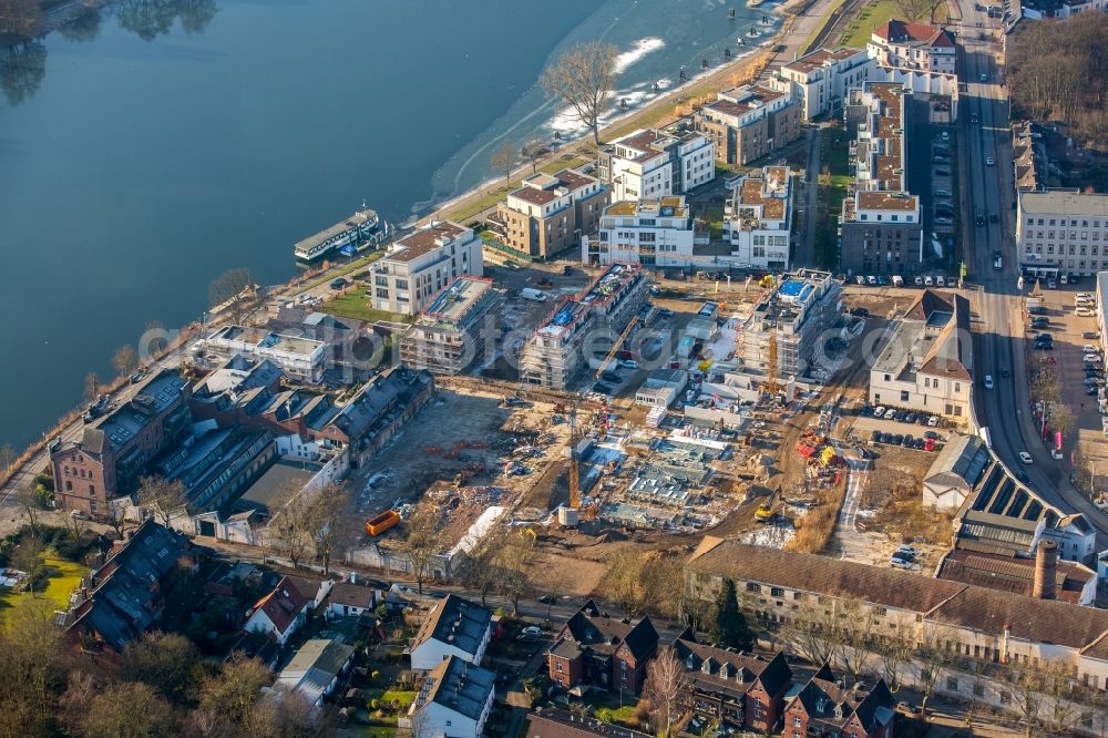 Essen from the bird's eye view: Construction site of the residential area Wohnen am Ruhrbogen on the riverbank of the Ruhr in Kettwig in the state of North Rhine-Westphalia