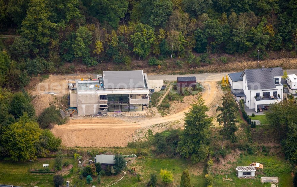 Netphen from the bird's eye view: Construction site for a new construction residential area of detached housing estate on Wichernstrasse in Netphen in the state North Rhine-Westphalia, Germany