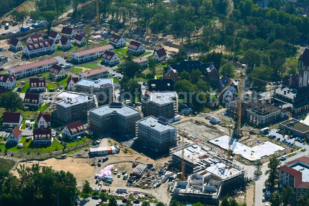 Aerial image Beelitz - Residential area construction site of a mixed development with multi-family houses and single-family houses- New building at the Quartier Beelitz-Heilstaetten in Beelitz in the state Brandenburg, Germany