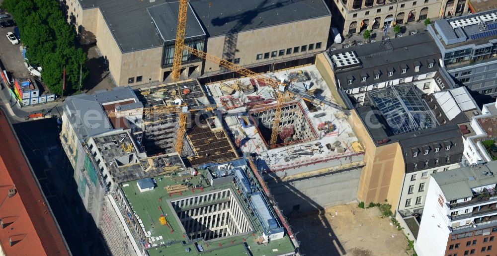 Berlin from the bird's eye view: Building site for construction of a residential house and commercial building at the corner Behrenstrasse Glinkastraße in Berlin - Mitte