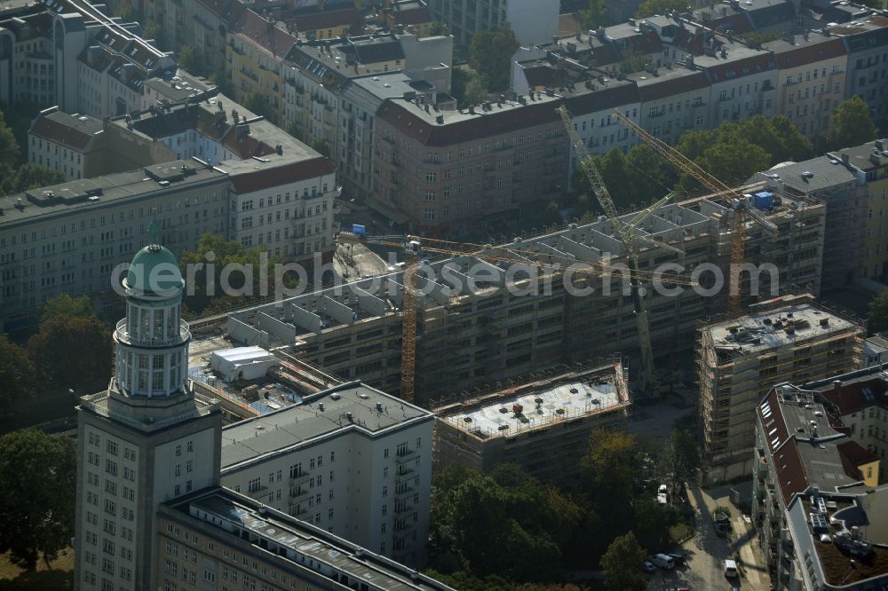 Aerial photograph Berlin - View on the building site for construction of a residential house and commercial building supervised by the DIW Bau GmbH at the Warschauer Strasse near Frankfurter Tor in Berlin in Germany