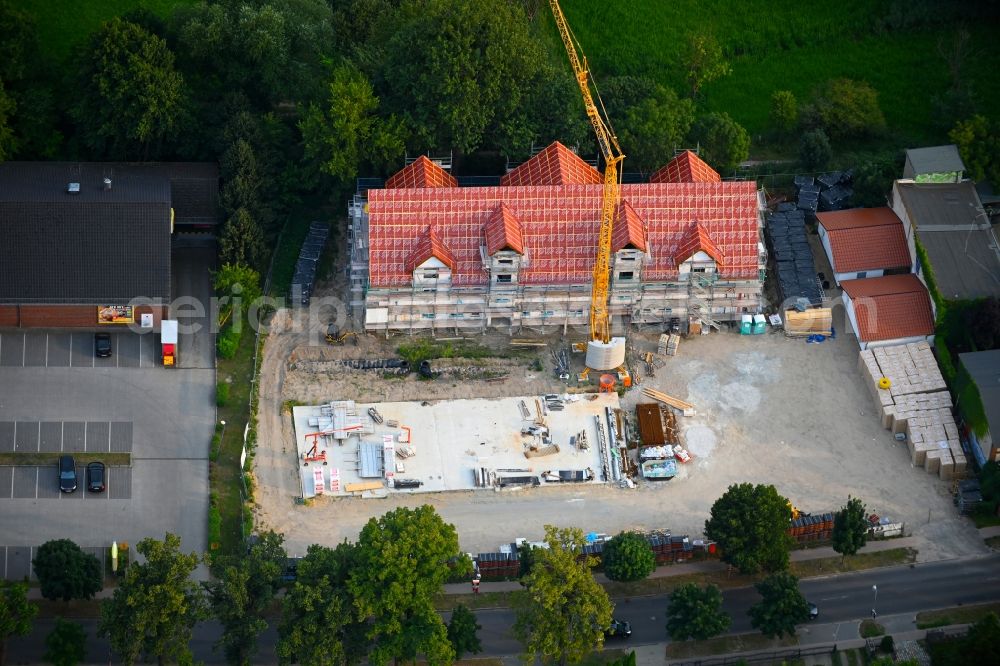 Altlandsberg from the bird's eye view: Construction site for the multi-family residential building on Berliner Allee in Altlandsberg in the state Brandenburg, Germany