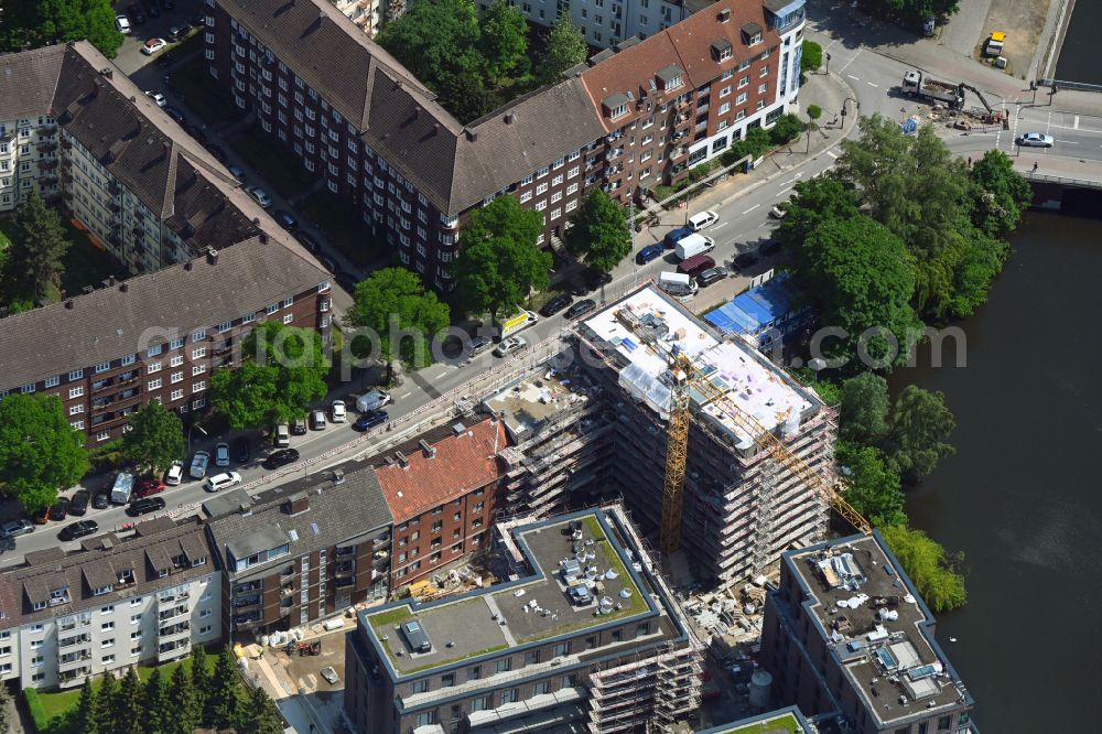 Hamburg from the bird's eye view: Construction site for the multi-family residential building in Blockhouse-Quartier on Hufnerstrasse - Osterbekkai in the district Barmbek in Hamburg, Germany