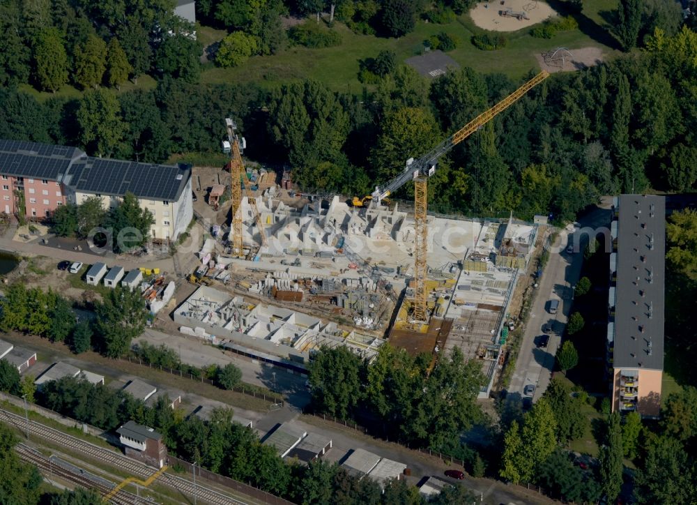 Aerial photograph Berlin - Construction site for the multi-family residential building on Hartriegelstrasse - Moosstrasse in the district Niederschoeneweide in Berlin, Germany