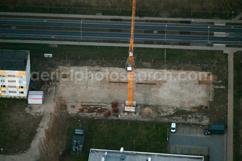 Aerial photograph Neuruppin - Construction site for the multi-family residential building on Heinrich-Rau-Strasse in Neuruppin in the state Brandenburg, Germany