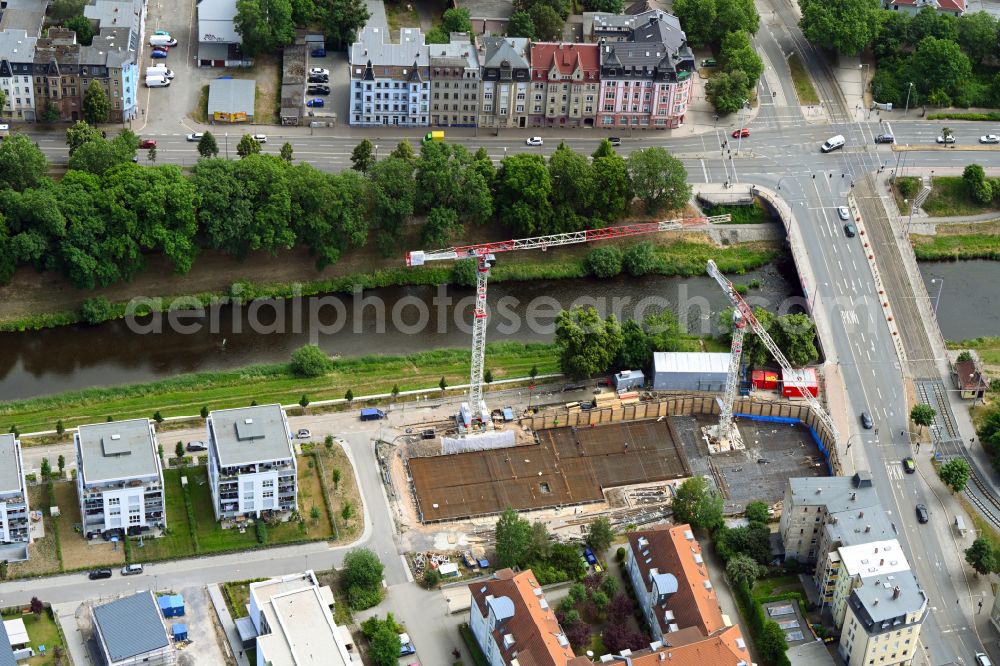 Gera from the bird's eye view: Construction site for the multi-family residential building of Das HeinrichsQuartier with altersgerechten Wohnungen in Gera in the state Thuringia, Germany