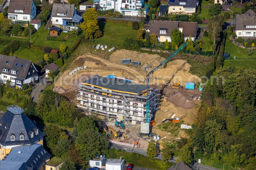 Hilchenbach from the bird's eye view: Construction site for the multi-family residential building on street Im Unteren Marktfeld in Hilchenbach at Siegerland in the state North Rhine-Westphalia, Germany