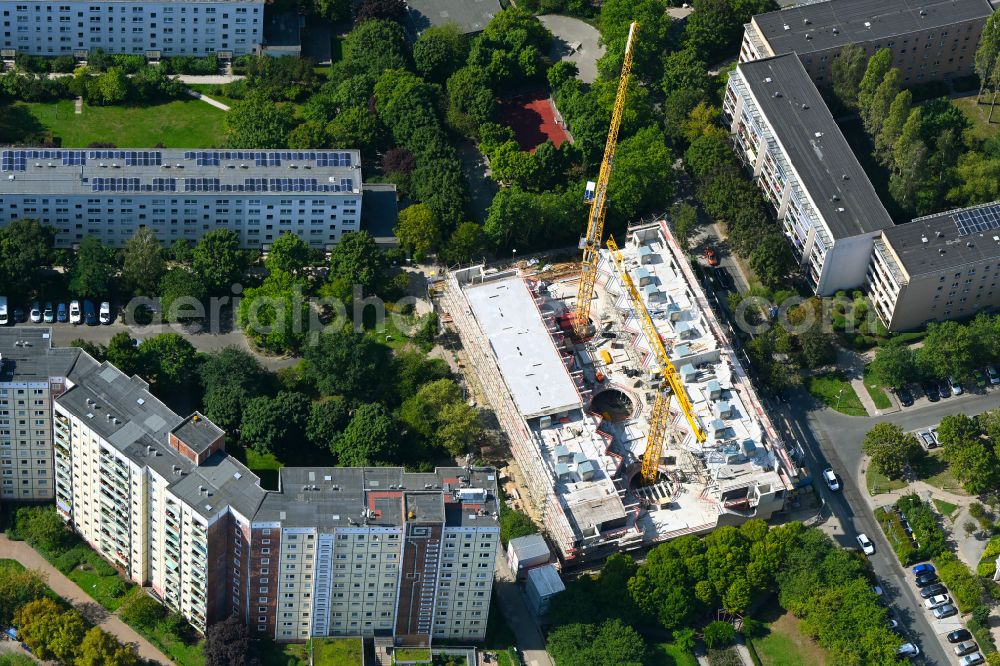 Berlin from the bird's eye view: Construction site for the multi-family residential building Lion-Feuchtwanger-Strasse in the district Hellersdorf in Berlin, Germany