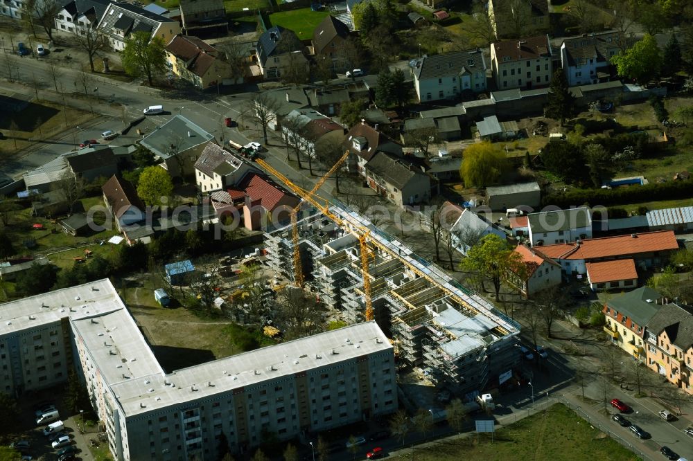 Hennigsdorf from above - Construction site for the multi-family residential building of the new building project Albert-Schweitzer-Quartier on Berliner Strasse in Hennigsdorf in the state Brandenburg, Germany