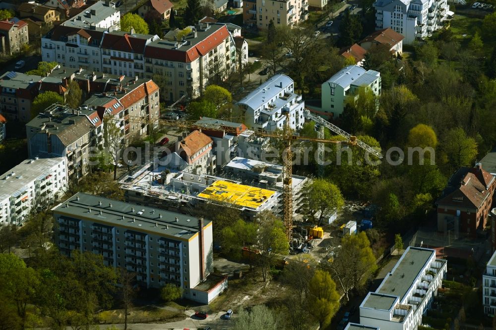 Berlin from above - Construction site for the multi-family residential building on Schlossallee in the district Niederschoenhausen in Berlin, Germany