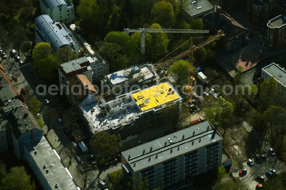 Berlin from the bird's eye view: Construction site for the multi-family residential building on Schlossallee in the district Niederschoenhausen in Berlin, Germany