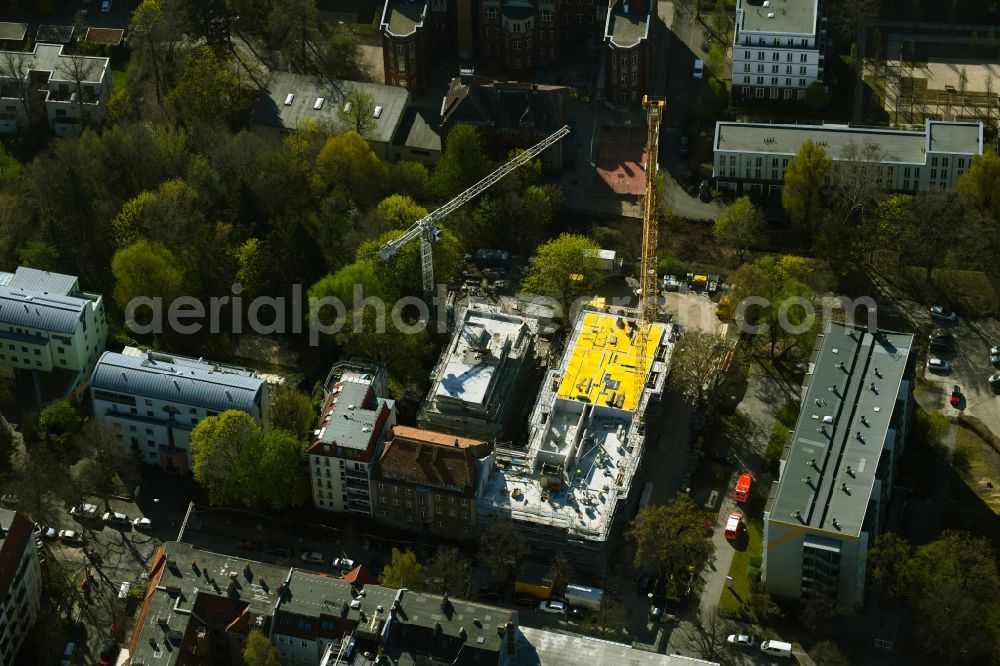 Berlin from above - Construction site for the multi-family residential building on Schlossallee in the district Niederschoenhausen in Berlin, Germany