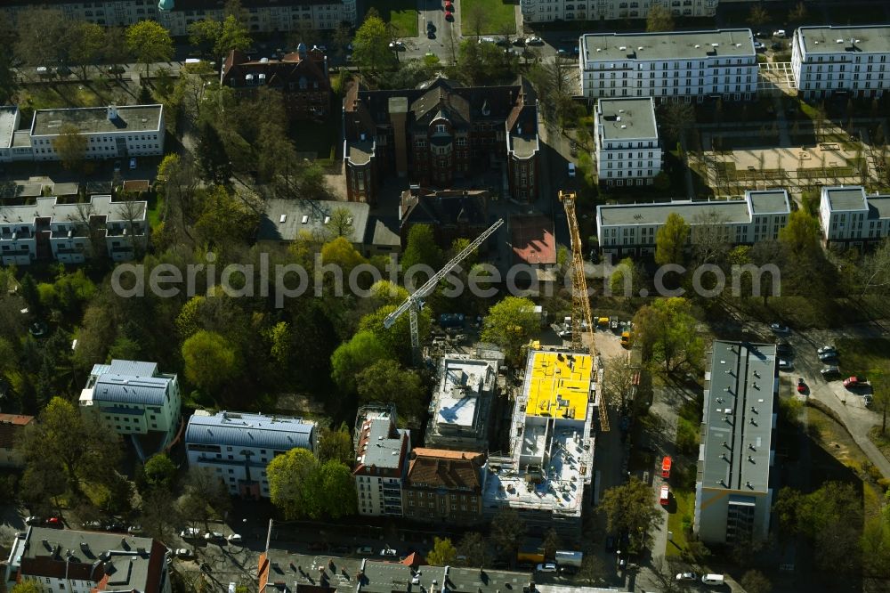 Berlin from the bird's eye view: Construction site for the multi-family residential building on Schlossallee in the district Niederschoenhausen in Berlin, Germany