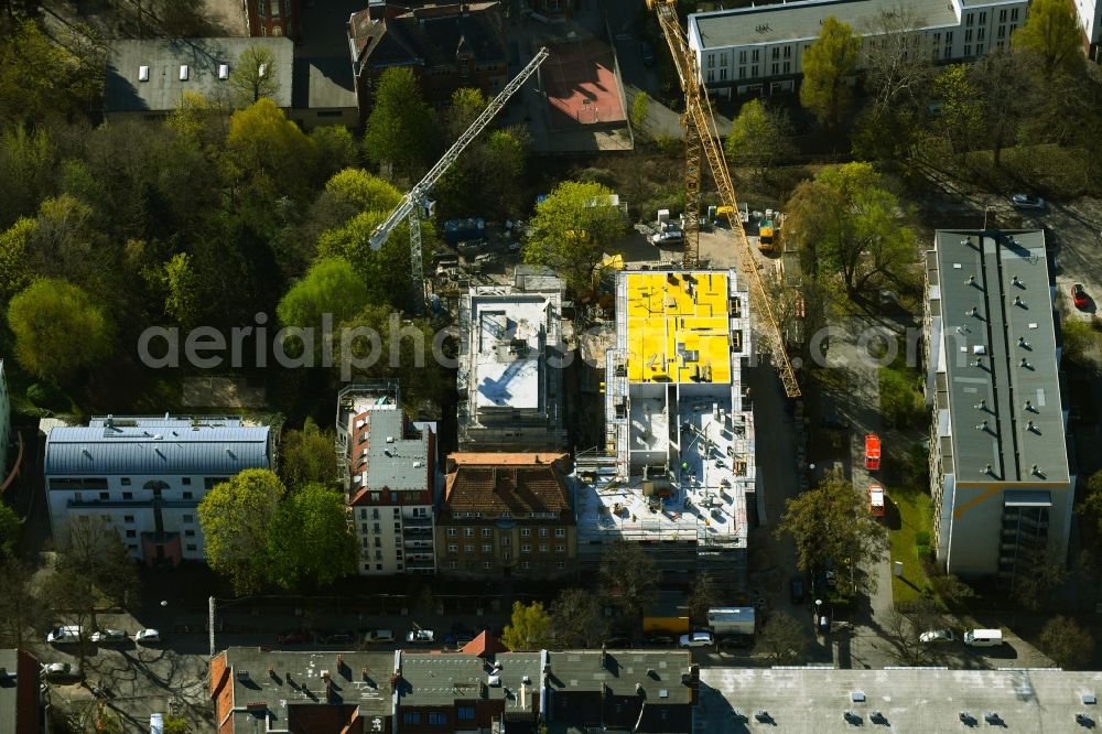 Aerial image Berlin - Construction site for the multi-family residential building on Schlossallee in the district Niederschoenhausen in Berlin, Germany