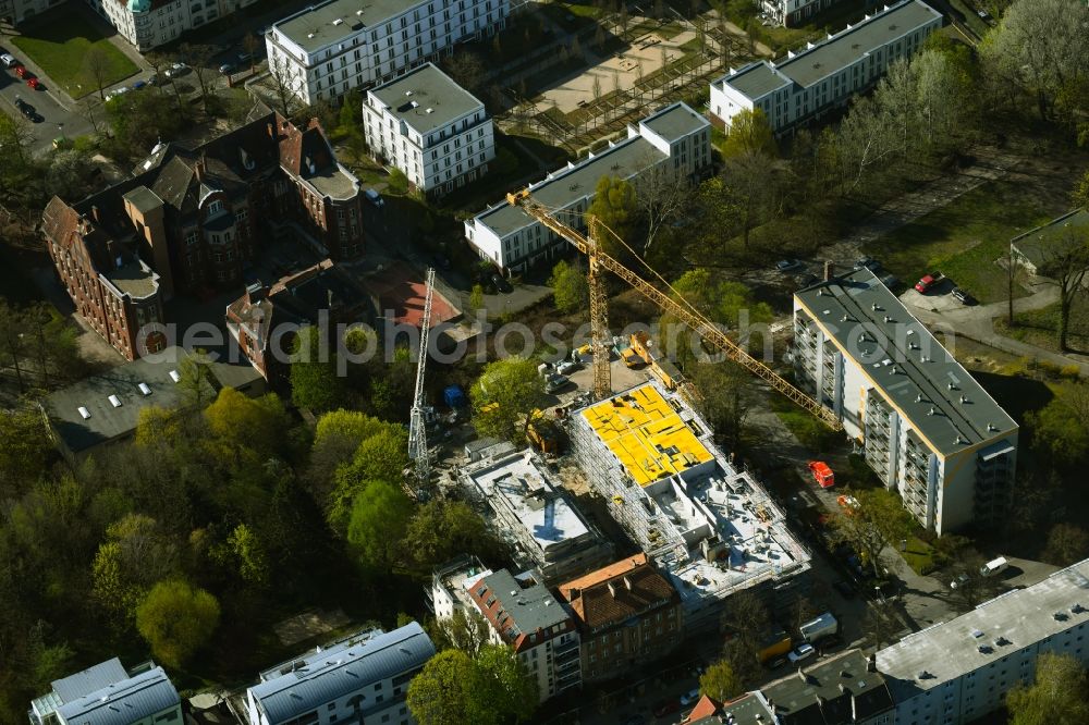 Berlin from above - Construction site for the multi-family residential building on Schlossallee in the district Niederschoenhausen in Berlin, Germany