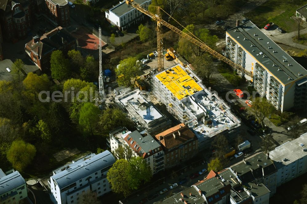 Berlin from the bird's eye view: Construction site for the multi-family residential building on Schlossallee in the district Niederschoenhausen in Berlin, Germany