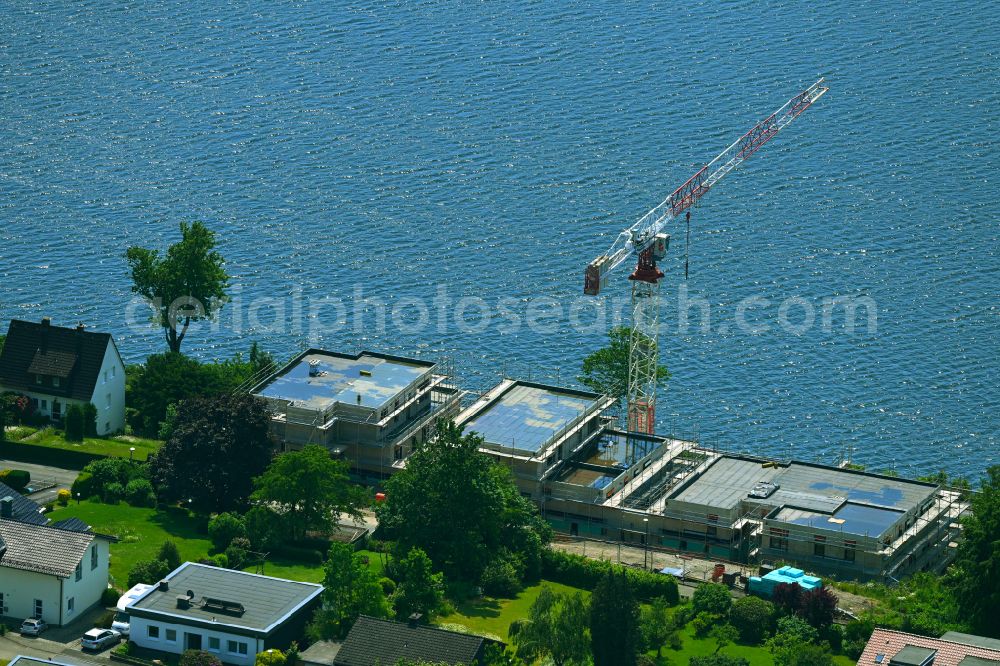 Körbecke from the bird's eye view: Construction site for the multi-family residential building on the shore of the Moehnesee on street Seeblick - Seestrasse in Koerbecke in the state North Rhine-Westphalia, Germany