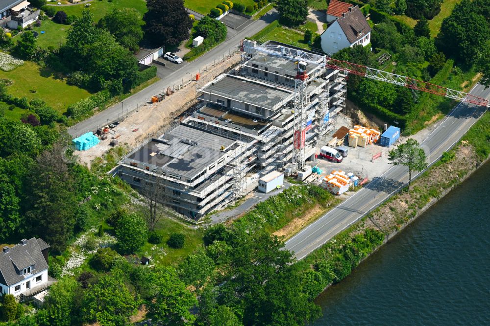 Körbecke from above - Construction site for the multi-family residential building on the shore of the Moehnesee on street Seeblick - Seestrasse in Koerbecke in the state North Rhine-Westphalia, Germany