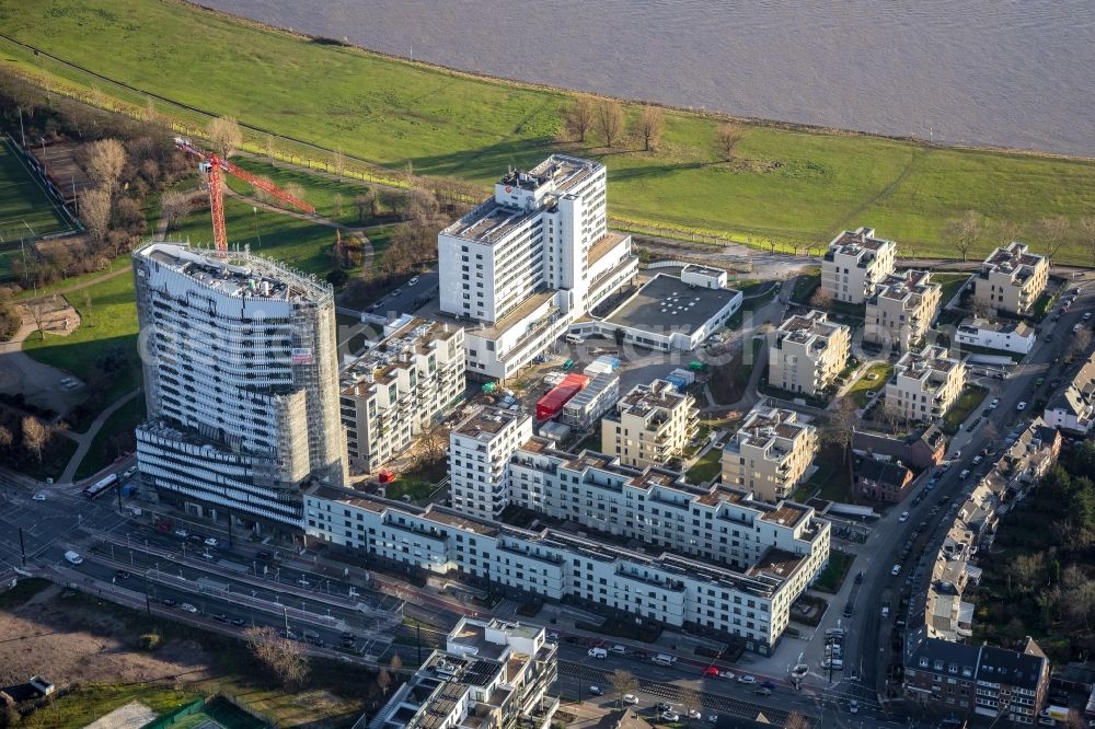 Düsseldorf from the bird's eye view: Construction site for the new construction of the high-rise residential building Rheinkilometer 740 (RKM 740) on Am Heerdter Krankenhaus in Duesseldorf in the state North Rhine-Westphalia, Germany