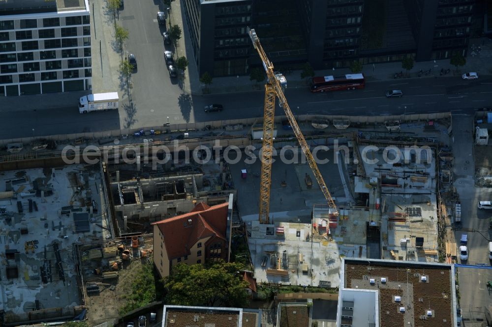 Berlin from the bird's eye view: Construction site of a residential high rise complex on the Northern riverbank of the river Spree in the Friedrichshain part of Berlin in Germany. The apartment buildings and towers are being built on Mariane-Von-Rantzau Strasse in close vicinity of newly built residential buildings. The two towers are a project of Wohnkompanie and are being called Max & Moritz