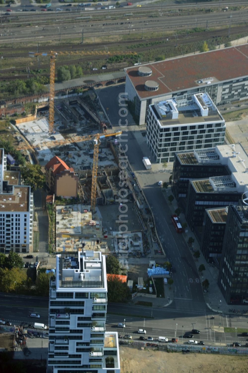 Berlin from above - Construction site of a residential high rise complex on the Northern riverbank of the river Spree in the Friedrichshain part of Berlin in Germany. The apartment buildings and towers are being built on Mariane-Von-Rantzau Strasse in close vicinity of newly built residential buildings. The two towers are a project of Wohnkompanie and are being called Max & Moritz