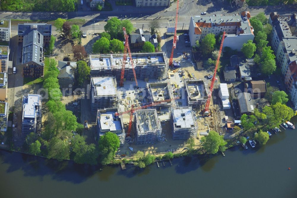 Aerial image Berlin - Construction site for new residential construction of RESIDENTIAL QUARTER UFERKRONE at the riverside at Linden Street in Berlin Koepenick