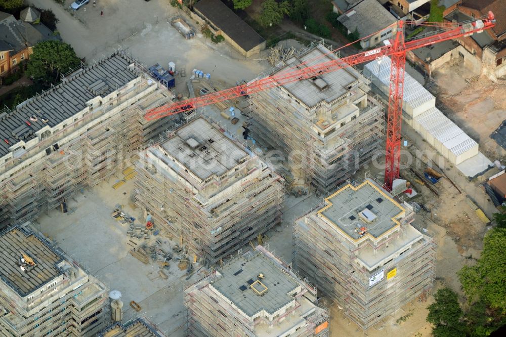 Berlin from above - Construction site for new residential construction of RESIDENTIAL QUARTER UFERKRONE at the riverside at Linden Street in Berlin Koepenick