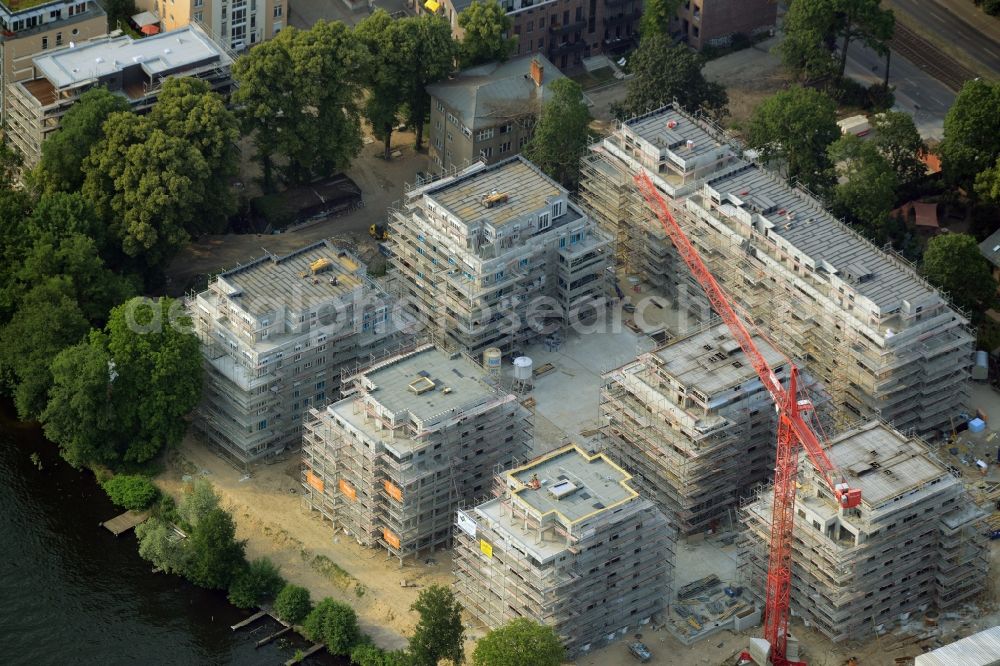 Aerial image Berlin - Construction site for new residential construction of RESIDENTIAL QUARTER UFERKRONE at the riverside at Linden Street in Berlin Koepenick