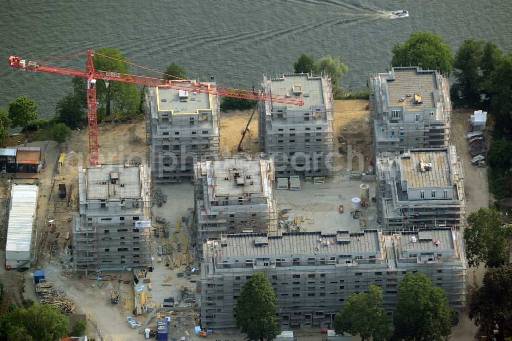 Berlin from above - Construction site for new residential construction of RESIDENTIAL QUARTER UFERKRONE at the riverside at Linden Street in Berlin Koepenick