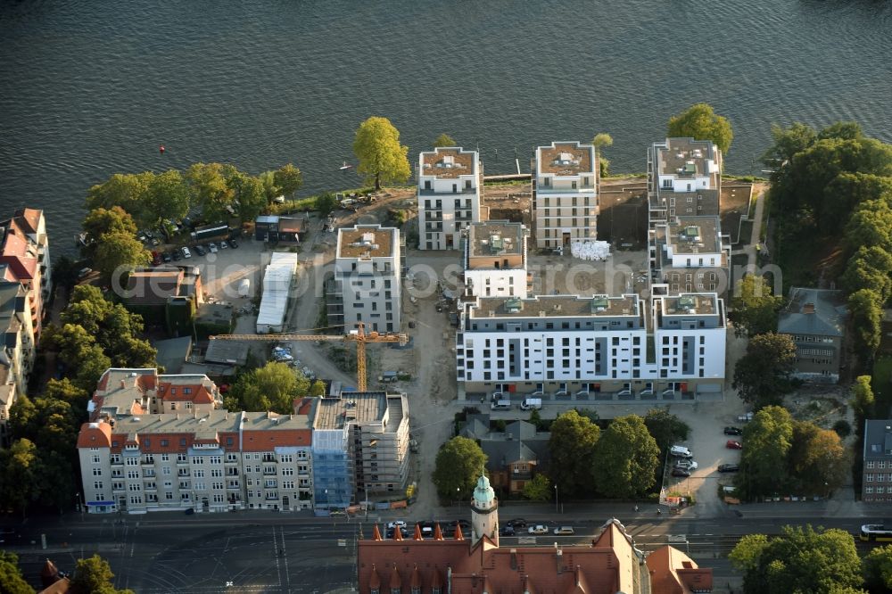 Berlin from above - Construction site for new residential construction of RESIDENTIAL QUARTER UFERKRONE at the riverside at Linden Street in Berlin Koepenick