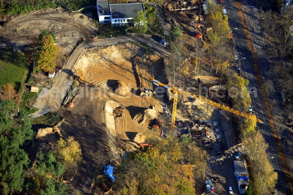 Aerial photograph Berlin OT Dahlem - Construction site for a residential area in Clayallee in the district of Steglitz-Zehlendorf in Berlin. The project is located on site of the former orthopedics clinic and home. The project is run by OHA Projektentwicklungsgesellschaft