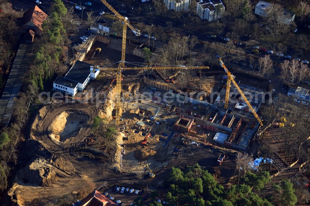 Aerial photograph Berlin OT Dahlem - Construction site for a residential area in Clayallee in the district of Steglitz-Zehlendorf in Berlin. The project is located on site of the former orthopedics clinic and home. The project is run by OHA Projektentwicklungsgesellschaft