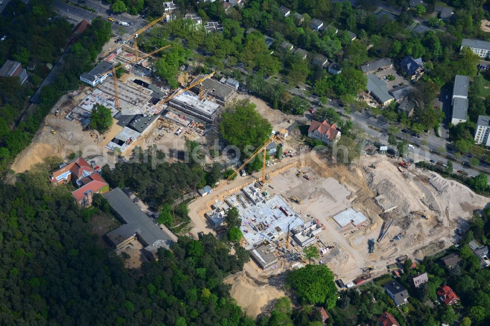 Aerial photograph Berlin OT Dahlem - Construction site for a residential area in Clayallee in the district of Steglitz-Zehlendorf in Berlin. The project is located on site of the former orthopedics clinic and home. The project is run by OHA Projektentwicklungsgesellschaft