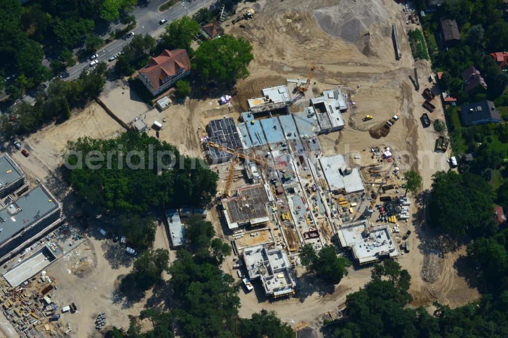 Aerial photograph Berlin OT Dahlem - Construction site for a residential area in Clayallee in the district of Steglitz-Zehlendorf in Berlin. The project is located on site of the former orthopedics clinic and home. The project is run by OHA Projektentwicklungsgesellschaft